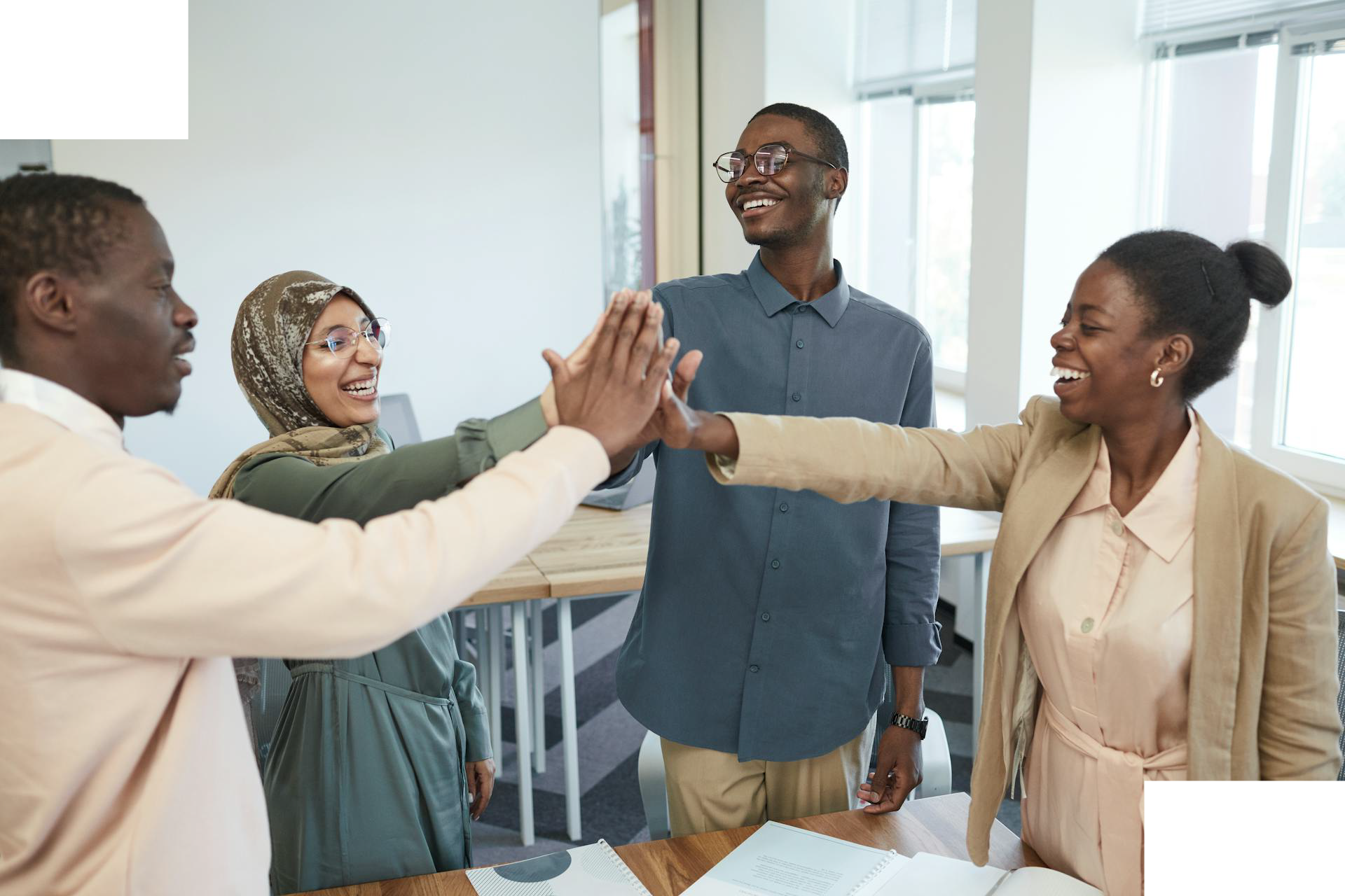 Youths high fiving in celebration